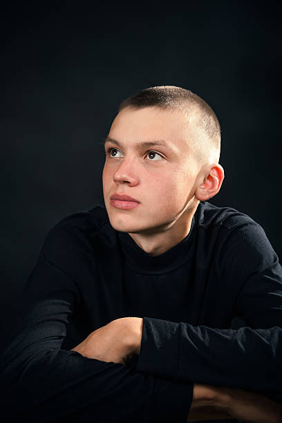 istock Young man in the black clothes, sadness 521385361