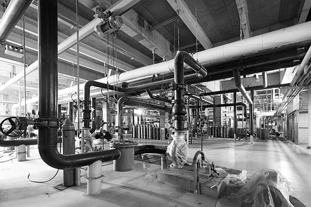 istock Equipment, cables and piping as found inside of industrial power 521385603