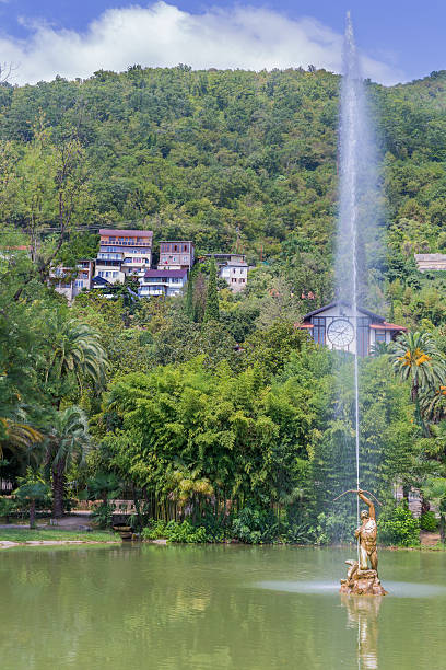 istock Small town with pond and fountain 521385814