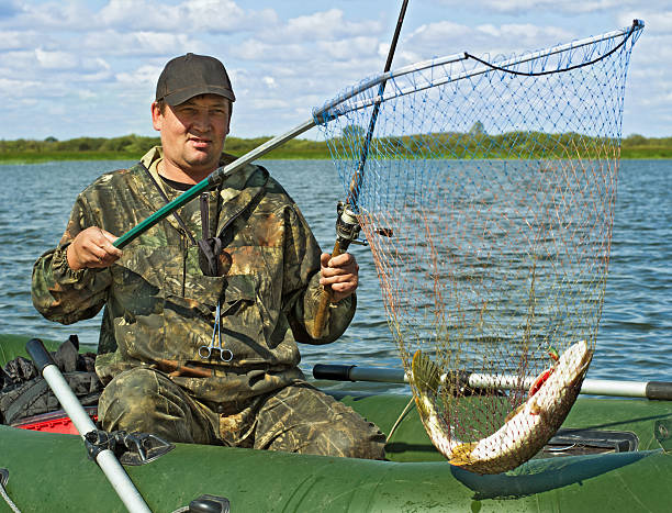 istock The fisherman caught a pike 521399801