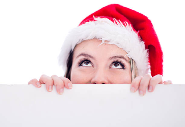 istock Female Santa with a banner 521400159