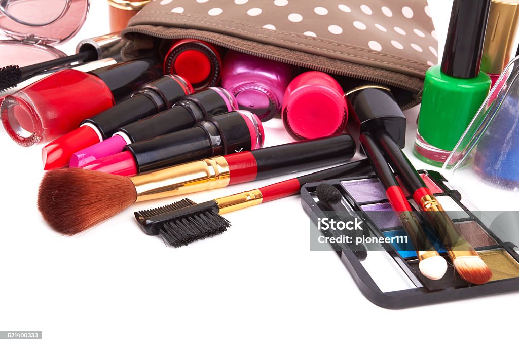 cosmetics Make up bag with cosmetics and brushes isolated on white Adult Stock Photo