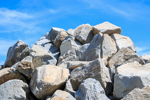 Pile of rocks against clear blue sky