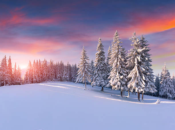 Colorful winter sunrise in the mountains stock photo