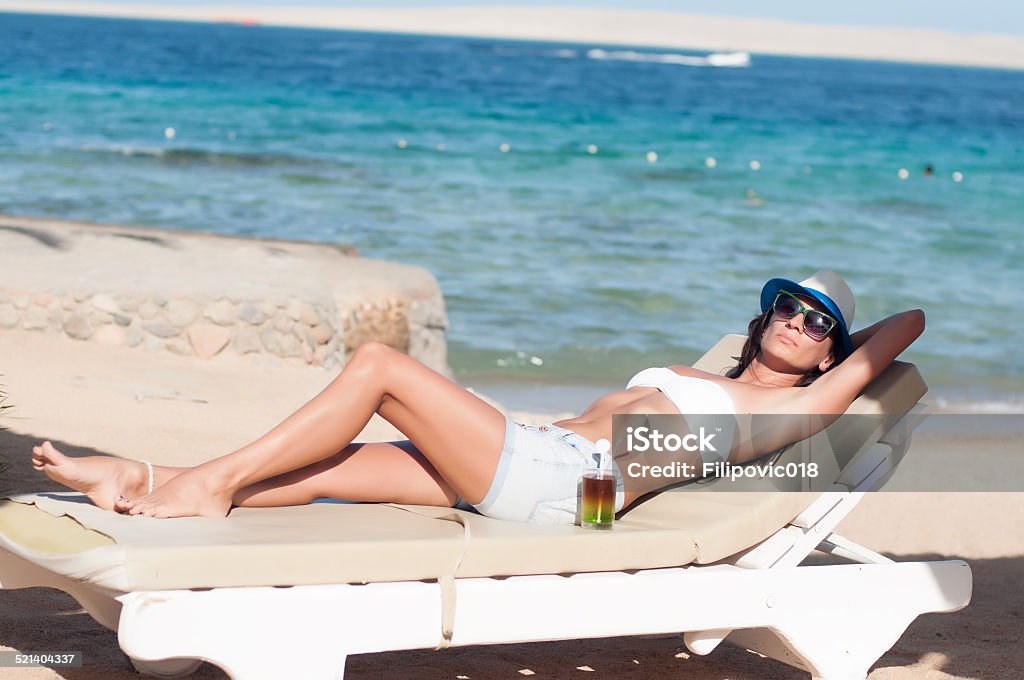 This is the life Beautiful Sexy Blonde Woman Relaxing By The Sea Adult Stock Photo