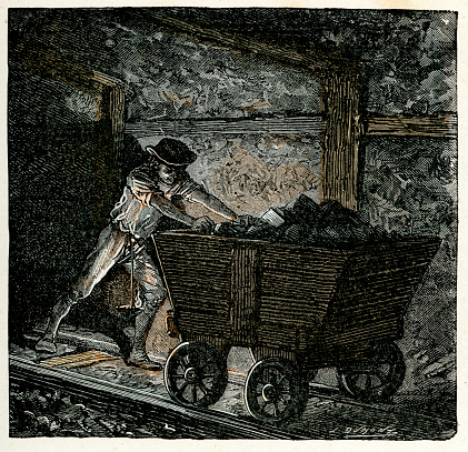 Victorian vintage engraving of a 19th century coal miner pushing coal in a minecart. The minecart or mine cart (also known as a mine trolley) is a type of rolling stock found on a mine railway, used for moving ore and materials procured in the process of traditional mining.  France, 1875