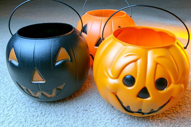 Three Heads Of Plastic Pumpkins As Decorations For Halloween Stock