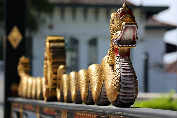 Snake sculpture outside the Sultan's office at the Royal Sultan Palace (aka Kraton Yogyakarta or Kraton Ngayogyakarta Hadiningrat) , which has been the home of the Yogyakarta Sultanate for several centuries. Built in the 18th Century, it is a complex of low-lying buildings such as audience halls, museums, and the residences surrounding large courtyards and open spaces.