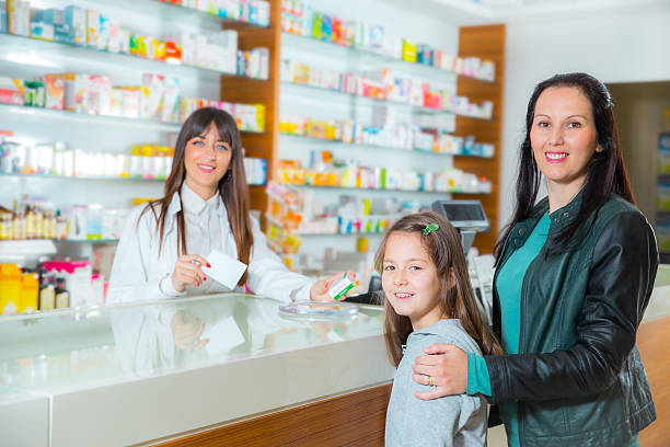 istock Mother with child at pharmacy 521406257