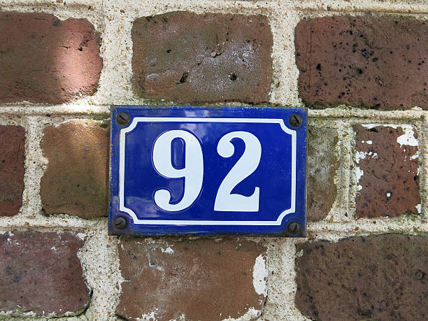 istock Number 92 Blue and White House Number on Brick Exterior 521417363