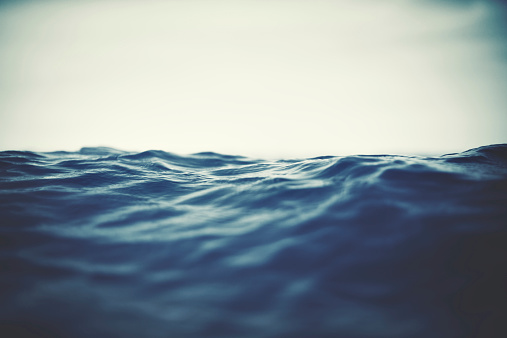 Water surface close-up. Low angle view, shallow DOF