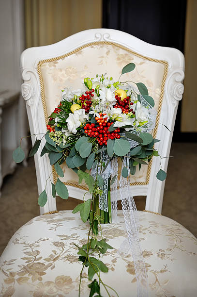 istock wedding autumn bouquet on a chair 521417619