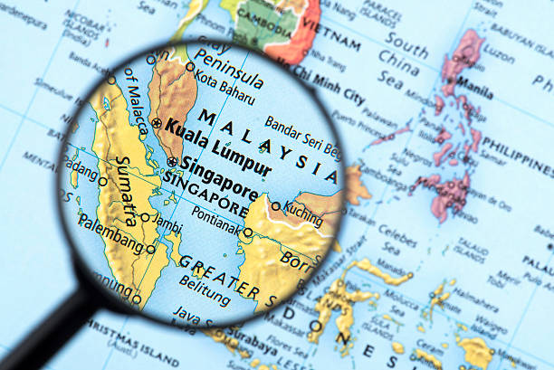 Map of Singapore Map of Singapore. Detail from the World Atlas. Selective Focus. singapore map stock pictures, royalty-free photos & images