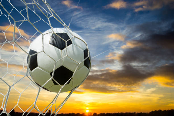 istock Soccer ball into Goal 521418104