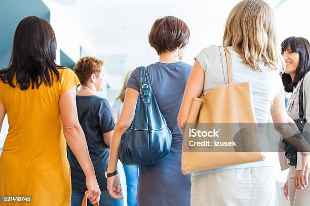 Group Of Women Walking The Hall Back View Stock Photo - Download Image Now - Crowd of People, Back, Event