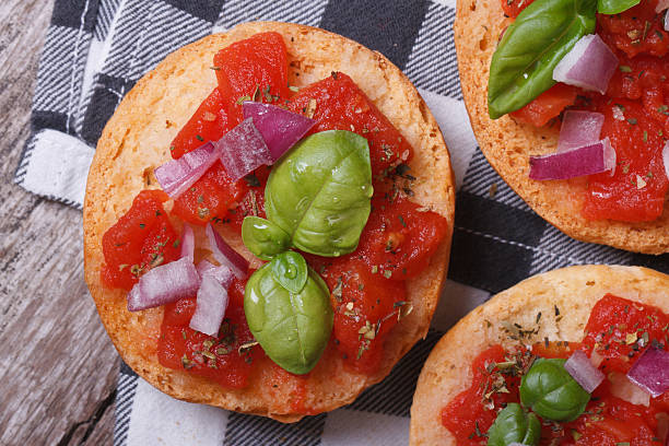 istock Italian bruschetta with tomato, onion and basil 521420799