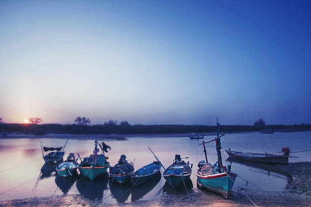 istock Boat stop on sea at sunset and peace time 521423610