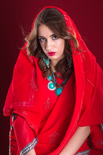 istock Woman in red sari 521424340