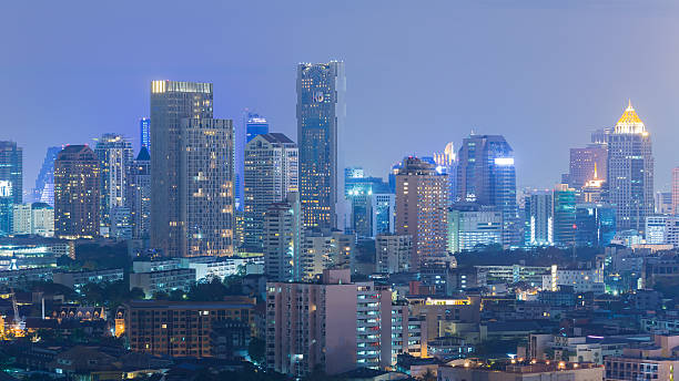 istock City office building at night 521425818