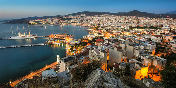 panorama von kusadasi - sea aegean sea night illuminated stock-fotos und bilder