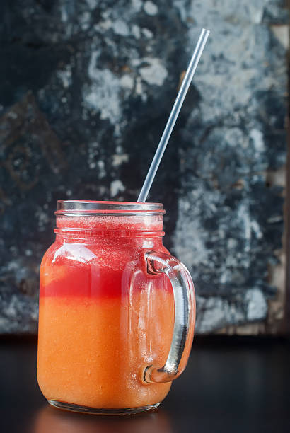 istock Smoothie Jar Red Orange Fruits Healthy Concept 521427486