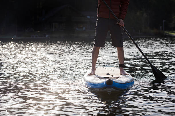 istock Stand up paddle boarding in the morning sun 521427786