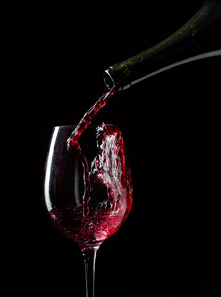 istock bottle and glass with red wine 521428638