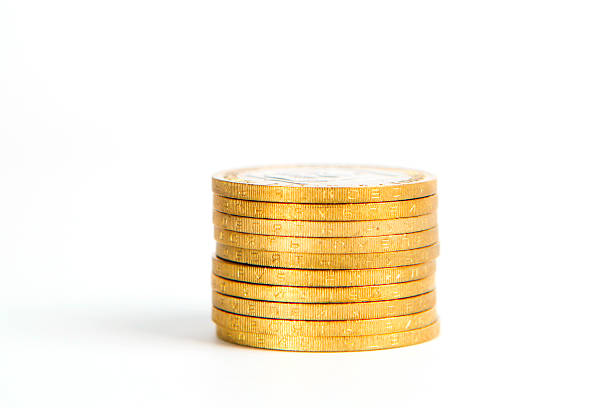 istock Crooked Stack of Shiny Gold Coins Isolated 521428864