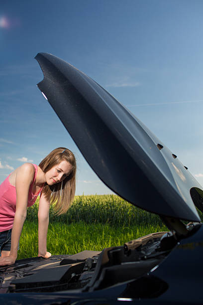 istock Pretty, young woman calling the roadside service 521435757