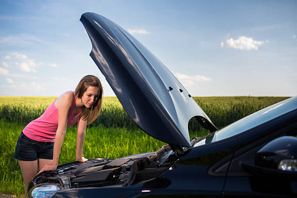 istock Pretty, young woman calling the roadside service 521435779