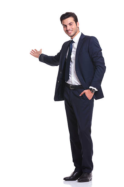 istock happy business man welcoming you 521438405
