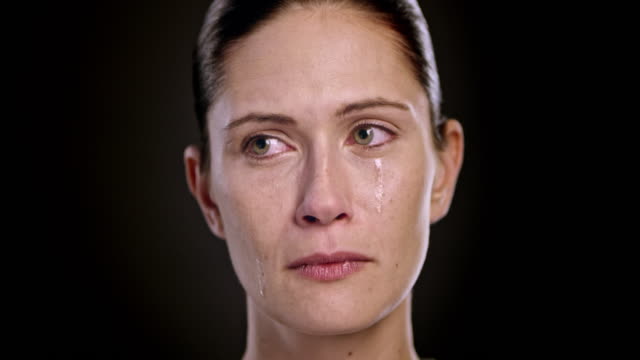 Face of a crying young Caucasian woman