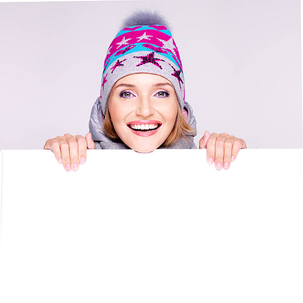istock Happy woman in winter outerwear over white banner 521438663