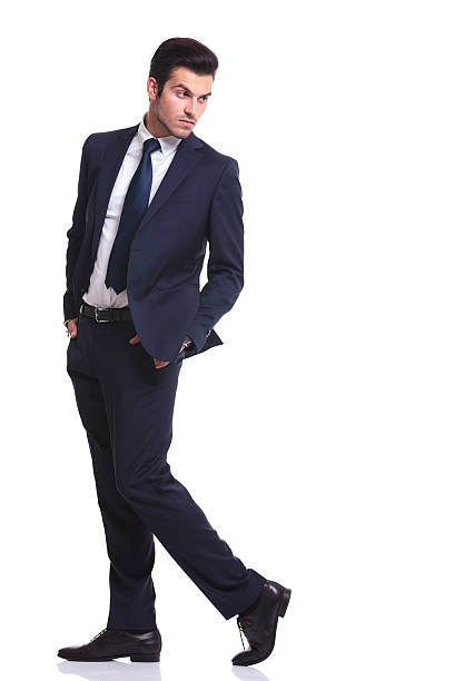 istock business man walking with his hands in pocket 521439019