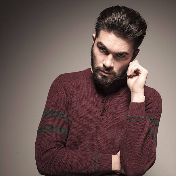 istock man holding his hand to his ear 521440745