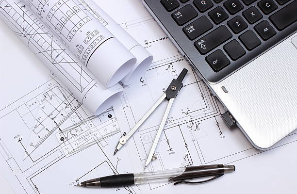 istock Electrical diagrams, accessories for drawing and laptop 521451999