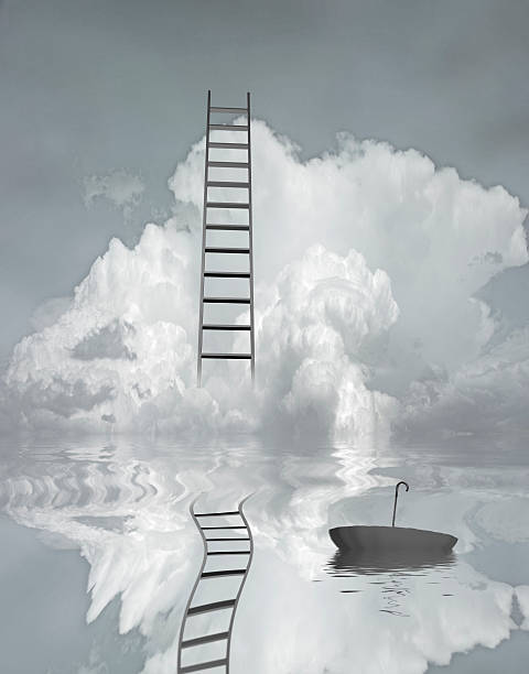 istock Ladder reflected in water with floating umbrella 521453065