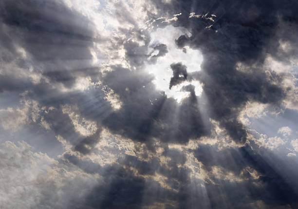 The face of Christ in the sky Dramatic clouds with sunbeams formed the face of Jesus Christ apocalypse photos stock pictures, royalty-free photos & images