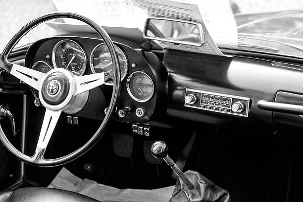 Mortara, Italy - September 28, 2014: view of the driver's seat of a Giulietta Spider, collectible Italian car of the 60s, exhibited at a country fair. Photo taken in a public place.