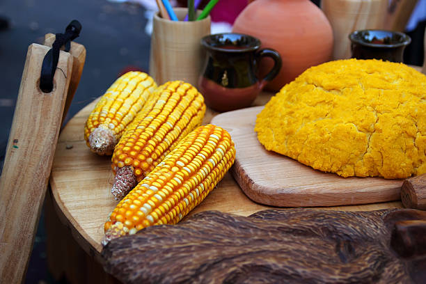 The national dish of mamaliga The national dish of mamaliga and corn cobs of the city at the festival in Chisinau. mamaliga stock pictures, royalty-free photos & images