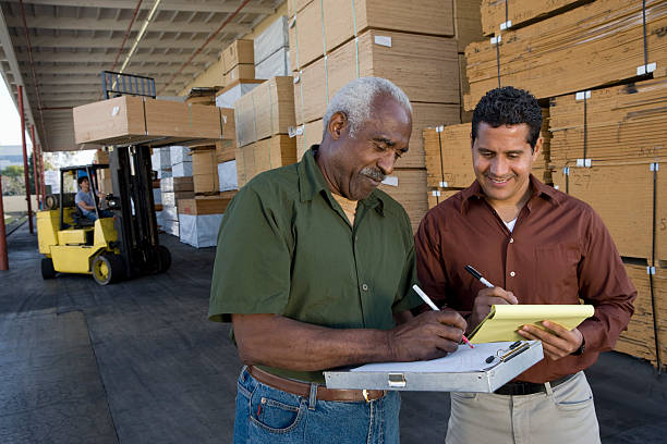 istock Men stock-taking in warehouse 521457677