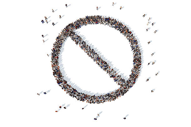 istock Group of people forming a no entry symbol 521457744
