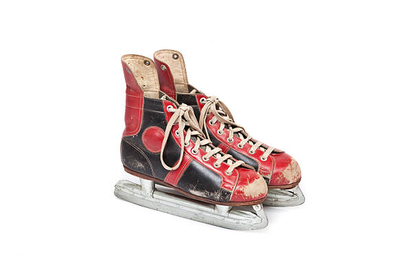 istock pair of used ice skates, white background 521458535