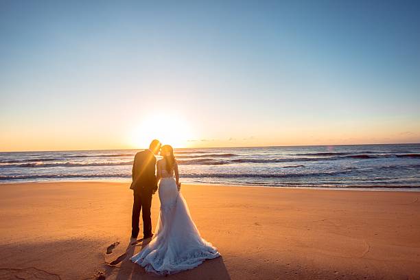 Beautiful bride and groom at the beach