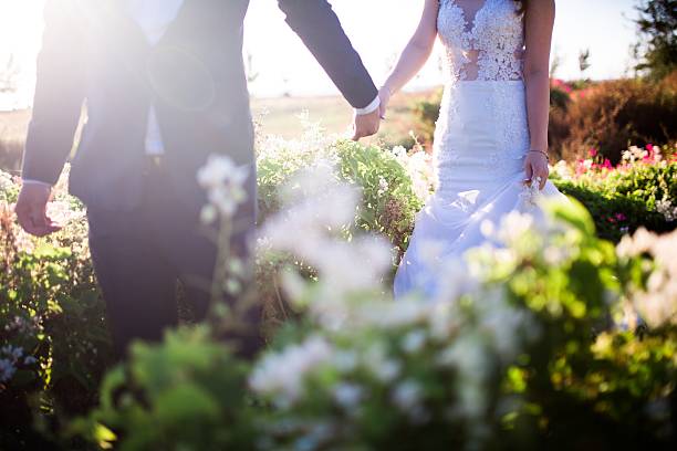 istock Beautiful bride and groom at the beach 521460524