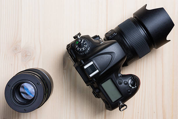 istock Photo camera and a lens top view 521460536