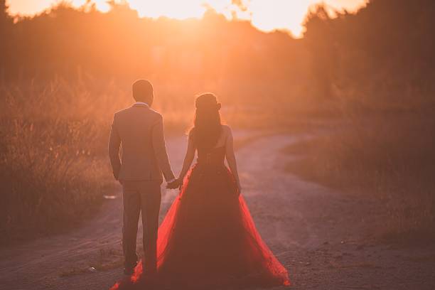 istock Beautiful bride and groom at the beach 521460836