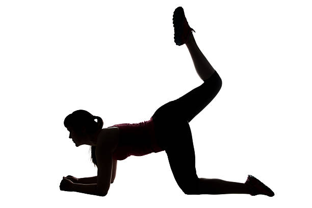 istock Silhouette of sport trainer with leg up 521461290