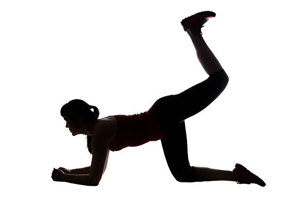 istock Silhouette of sport trainer pumping buttocks 521461308