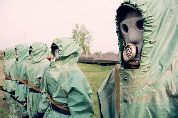 istock Soldiers in their masks and protective clothing 521461394